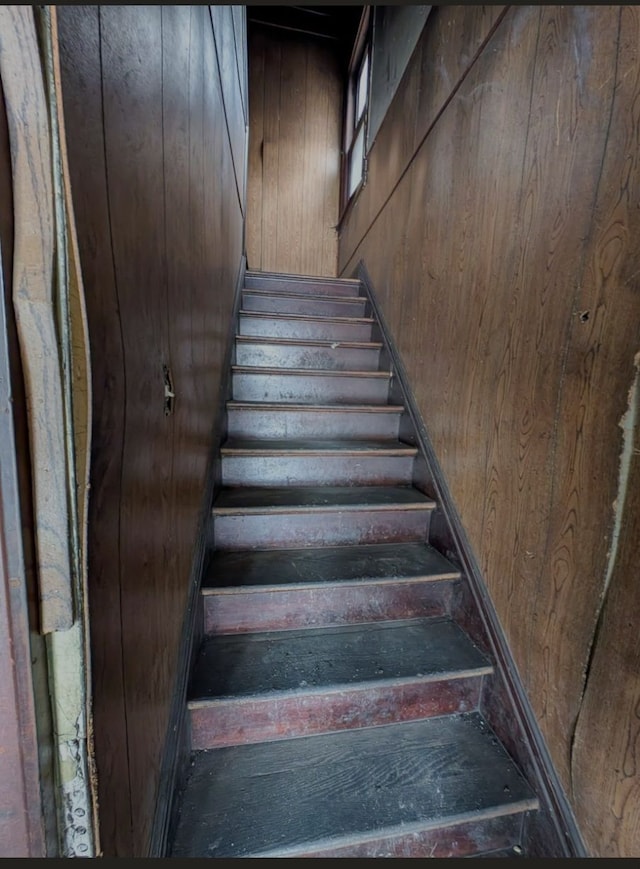 2738 Elmhurst St, Detroit, MI 48206 - staircase featuring wooden walls