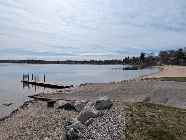 dock featuring a boat ramp and a water view