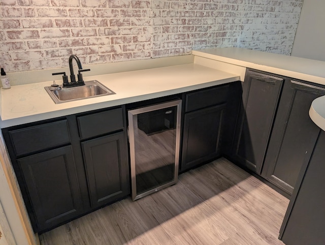 5657 Harding Ave, Muskegon, MI 49442 - indoor wet bar with beverage cooler and light wood finished floors