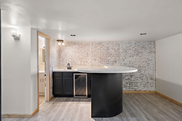 5657 Harding Ave, Muskegon, MI 49442 - indoor wet bar featuring wine cooler and light wood finished floors