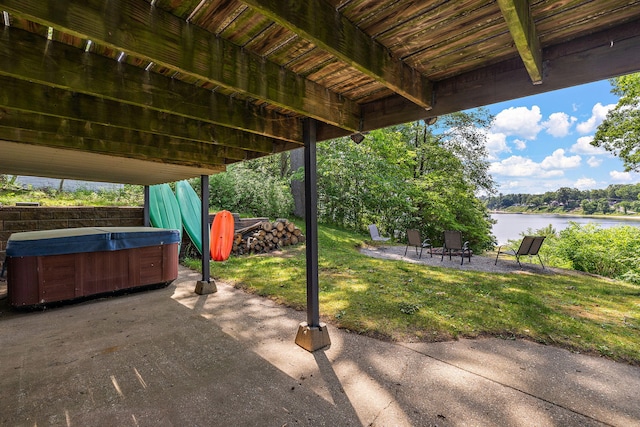 5657 Harding Ave, Muskegon, MI 49442 - view of patio / terrace with a hot tub and a water view