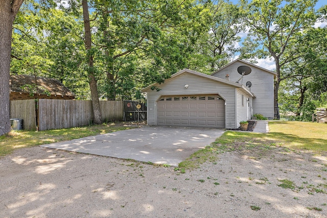 5657 Harding Ave, Muskegon, MI 49442 - view of front of house with driveway and a garage