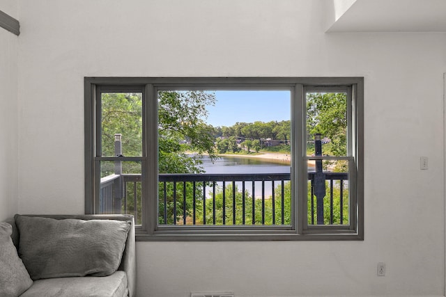 5657 Harding Ave, Muskegon, MI 49442 - living area featuring a water view and healthy amount of natural light