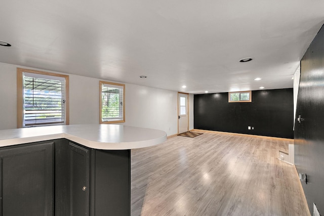 5657 Harding Ave, Muskegon, MI 49442 - kitchen with light countertops, light wood-type flooring, open floor plan, and recessed lighting