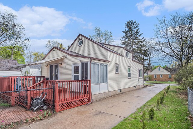 bungalow featuring a wooden deck