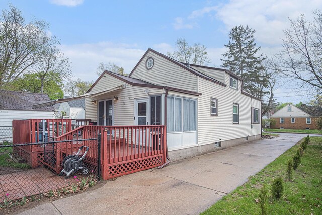 bungalow featuring a wooden deck