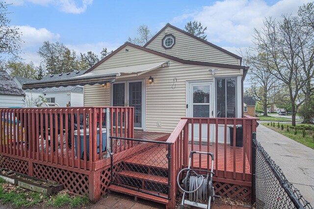 back of house with a wooden deck