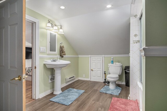 full bathroom with wood finished floors, toilet, a baseboard radiator, baseboards, and recessed lighting