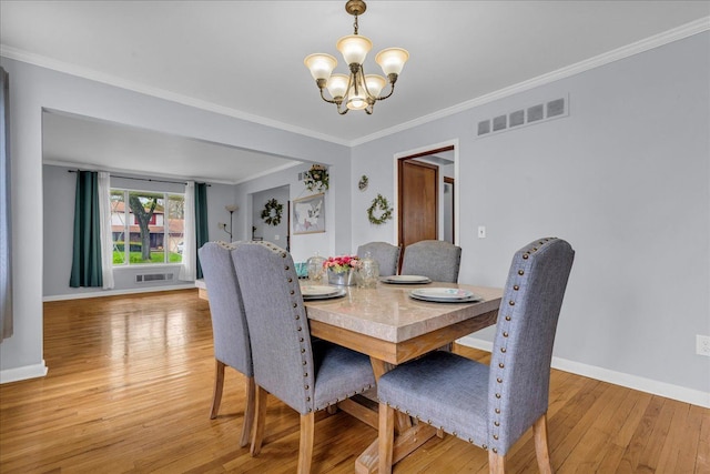 18579 Jeanette St, Southfield, MI 48075 - dining room with a chandelier, light wood-style floors, baseboards, and ornamental molding