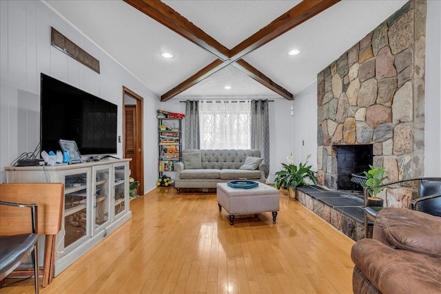 18579 Jeanette St, Southfield, MI 48075 - living area featuring light wood-style flooring, recessed lighting, and a stone fireplace