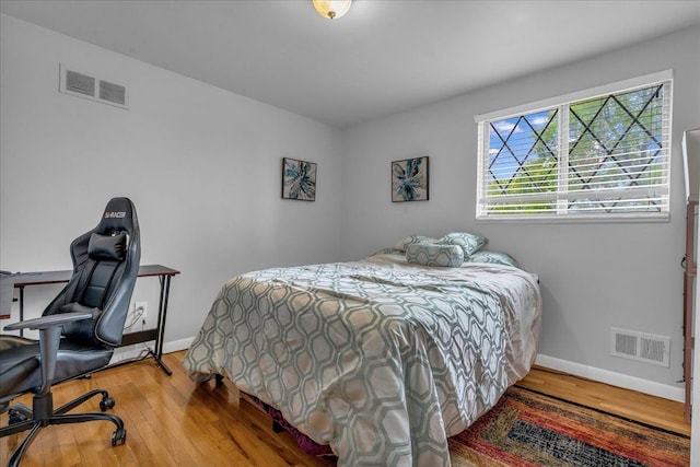 18579 Jeanette St, Southfield, MI 48075 - bedroom with baseboards, wood finished floors, and an office area