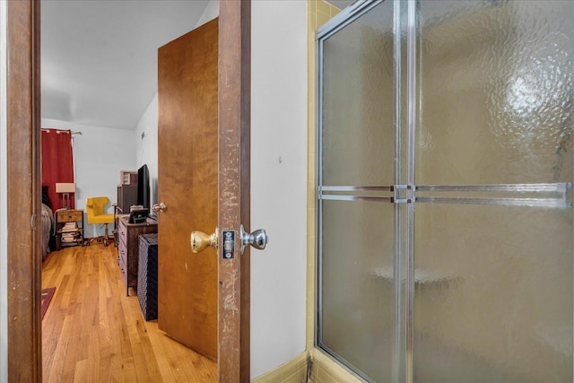 18579 Jeanette St, Southfield, MI 48075 - ensuite bathroom featuring wood finished floors and an enclosed shower