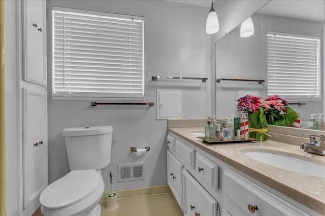 18579 Jeanette St, Southfield, MI 48075 - bathroom with toilet, double vanity, and baseboards