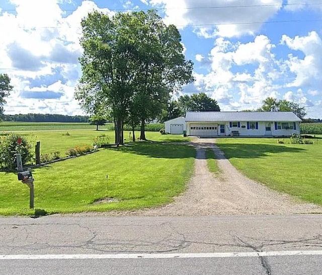 31915 M 60, Leonidas, MI 49066 - view of front of property with driveway, a front yard, and a garage