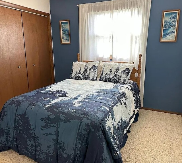 31915 M 60, Leonidas, MI 49066 - carpeted bedroom featuring a closet and baseboards