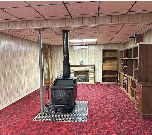 31915 M 60, Leonidas, MI 49066 - finished below grade area with carpet flooring, a wood stove, wood walls, and a drop ceiling