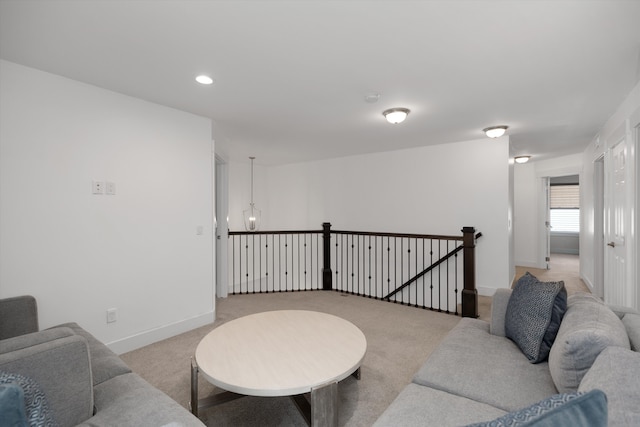 living room with light colored carpet, baseboards, and recessed lighting