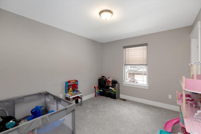 bedroom with carpet flooring and baseboards