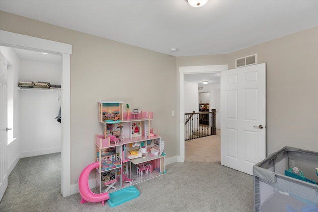 playroom featuring carpet flooring and baseboards