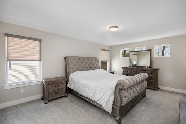 bedroom with carpet and baseboards
