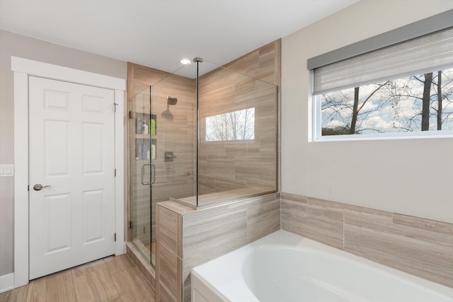 full bath featuring a stall shower and a bath