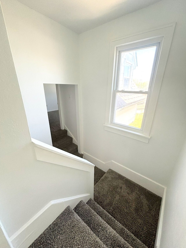 stairs featuring baseboards