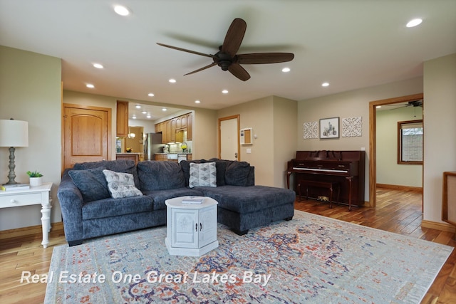 1416 Airfield Ln, Midland, MI 48642 - living room featuring ceiling fan, recessed lighting, wood finished floors, and baseboards