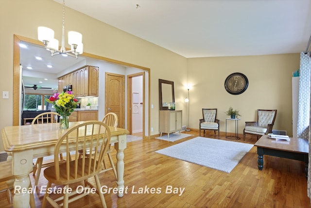 1416 Airfield Ln, Midland, MI 48642 - dining space with light wood-style flooring, a chandelier, and baseboards