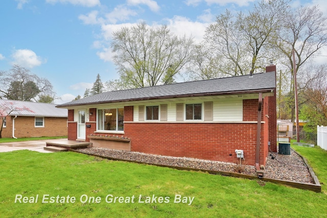 1416 Airfield Ln, Midland, MI 48642 - ranch-style house with brick siding and a chimney