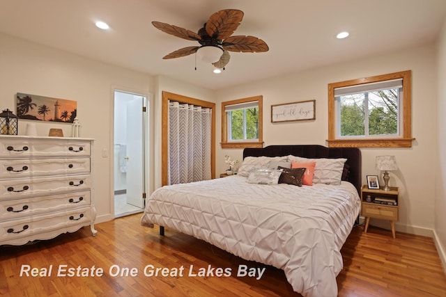 1416 Airfield Ln, Midland, MI 48642 - bedroom featuring light wood-type flooring, baseboards, recessed lighting, a ceiling fan, and connected bathroom