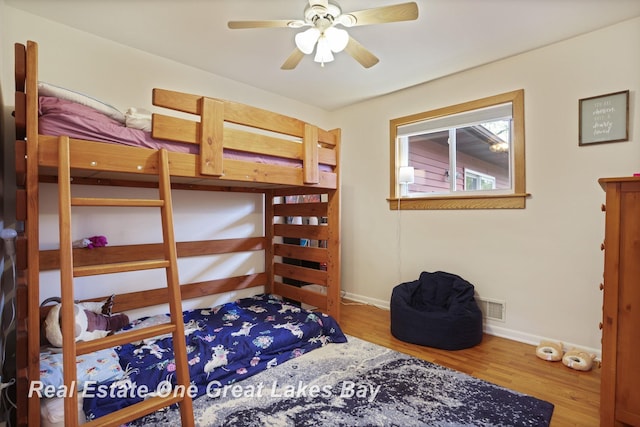 1416 Airfield Ln, Midland, MI 48642 - bedroom with baseboards and wood finished floors