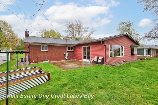 1416 Airfield Ln, Midland, MI 48642 - back of property featuring a chimney, a patio, and brick siding