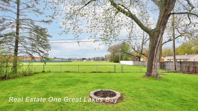 1416 Airfield Ln, Midland, MI 48642 - view of yard featuring a fire pit