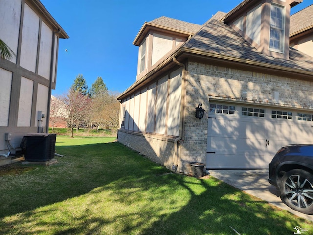 view of property exterior with brick siding, an attached garage, central AC, a lawn, and a shingled roof