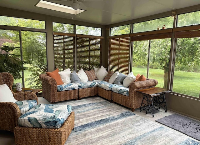 sunroom with plenty of natural light and a skylight