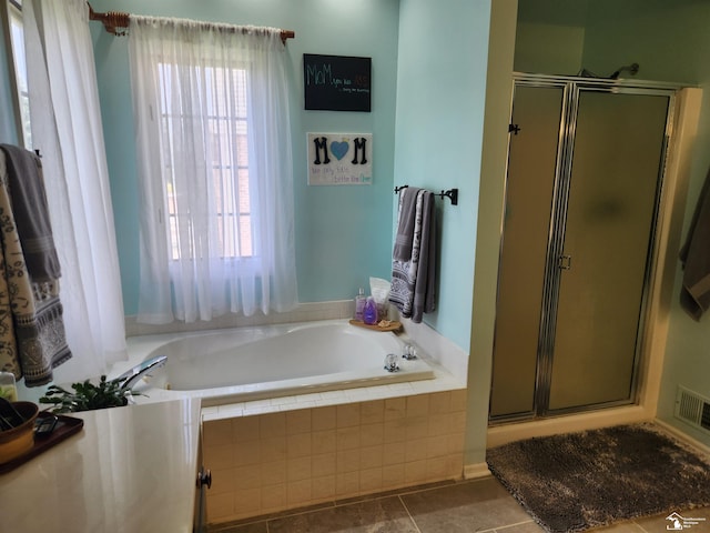912 Kings Park Rd, Monroe, MI 48161 - full bath featuring a bath, a stall shower, and tile patterned flooring