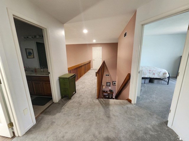 912 Kings Park Rd, Monroe, MI 48161 - hall featuring an upstairs landing, carpet flooring, and recessed lighting