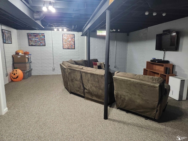 912 Kings Park Rd, Monroe, MI 48161 - carpeted living room featuring brick wall