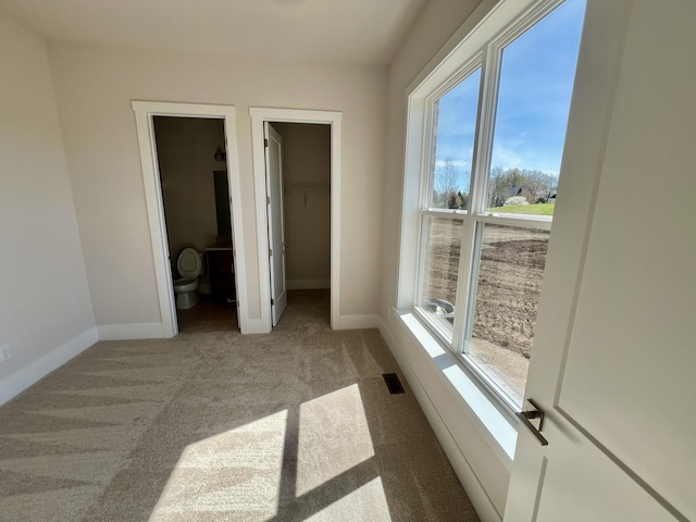 20846 Farrier Pl, Northville, MI 48167 - unfurnished bedroom with carpet flooring, baseboards, and a spacious closet