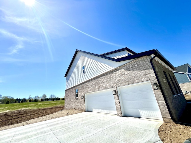 20846 Farrier Pl, Northville, MI 48167 - view of property exterior with concrete driveway, brick siding, stone siding, and a garage