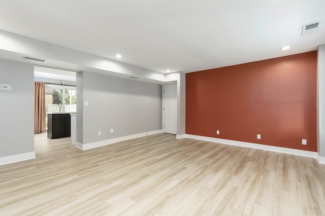 3246 Millwall Ave, Keego Harbor, MI 48320 - unfurnished living room featuring light wood-type flooring, recessed lighting, and baseboards