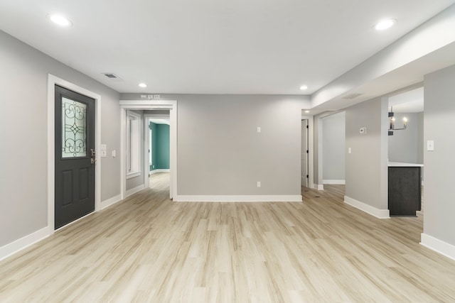 3246 Millwall Ave, Keego Harbor, MI 48320 - unfurnished living room with light wood-style floors, baseboards, and recessed lighting