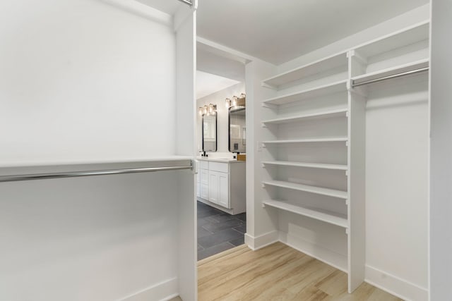 3246 Millwall Ave, Keego Harbor, MI 48320 - spacious closet featuring light wood-style flooring