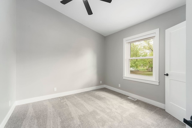 3246 Millwall Ave, Keego Harbor, MI 48320 - carpeted empty room with a ceiling fan, baseboards, and vaulted ceiling