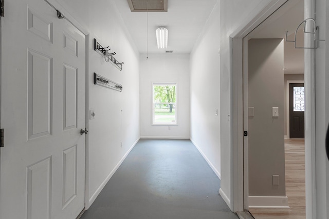 3246 Millwall Ave, Keego Harbor, MI 48320 - corridor with attic access, baseboards, and concrete floors