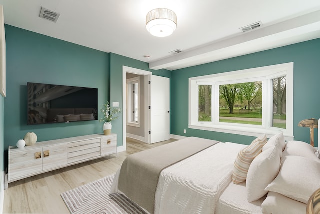 3246 Millwall Ave, Keego Harbor, MI 48320 - bedroom featuring multiple windows, wood finished floors, and baseboards