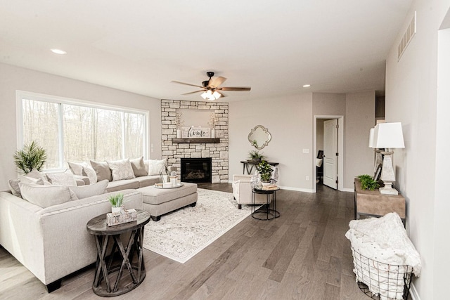 living room featuring a ceiling fan, recessed lighting, wood finished floors, a fireplace, and baseboards