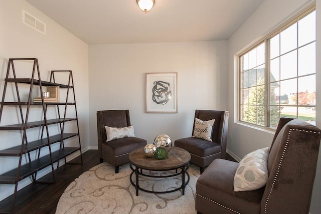 sitting room with wood finished floors and baseboards