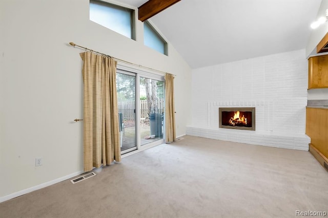 unfurnished living room featuring high vaulted ceiling, beam ceiling, carpet flooring, a fireplace, and baseboards