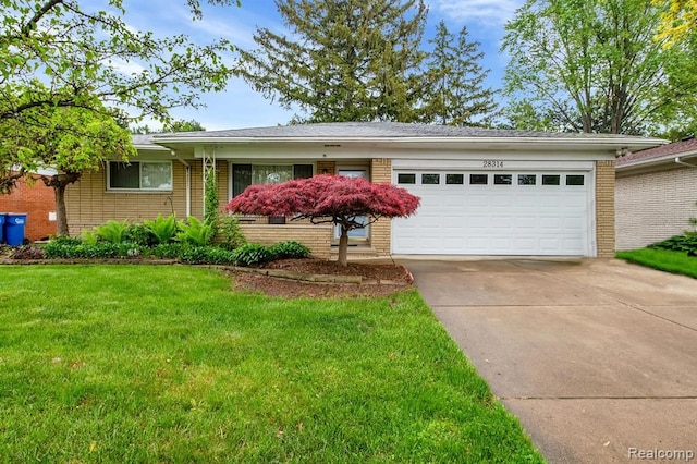 ranch-style house featuring brick siding, driveway, a garage, and a front lawn